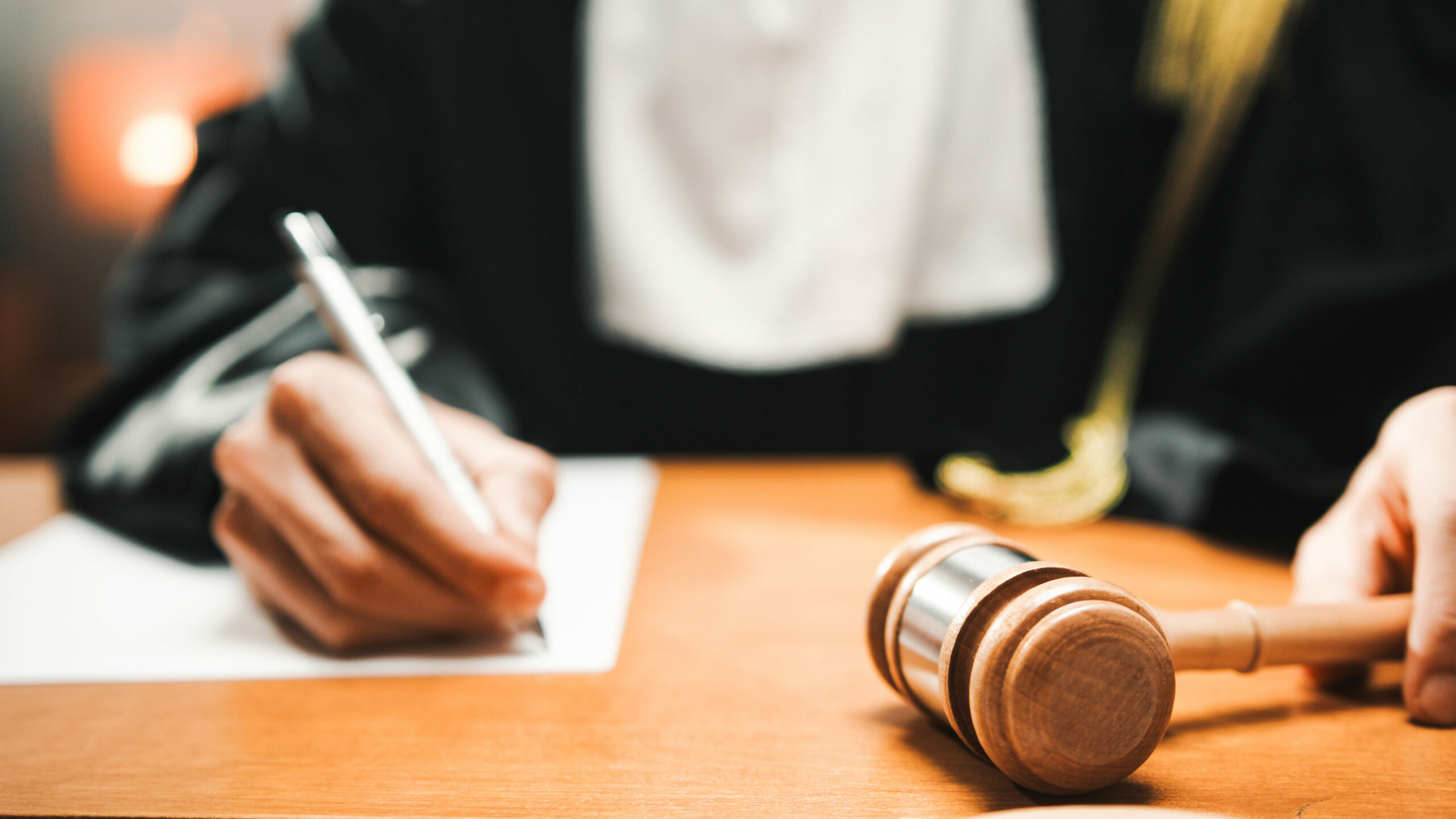 Judge reads the sentence to be afflicted on the criminal in the courtroom